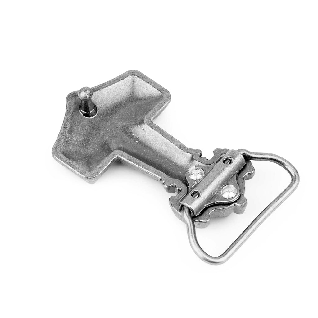 Gammalt spänne i form av torshammaren från Ödeshög