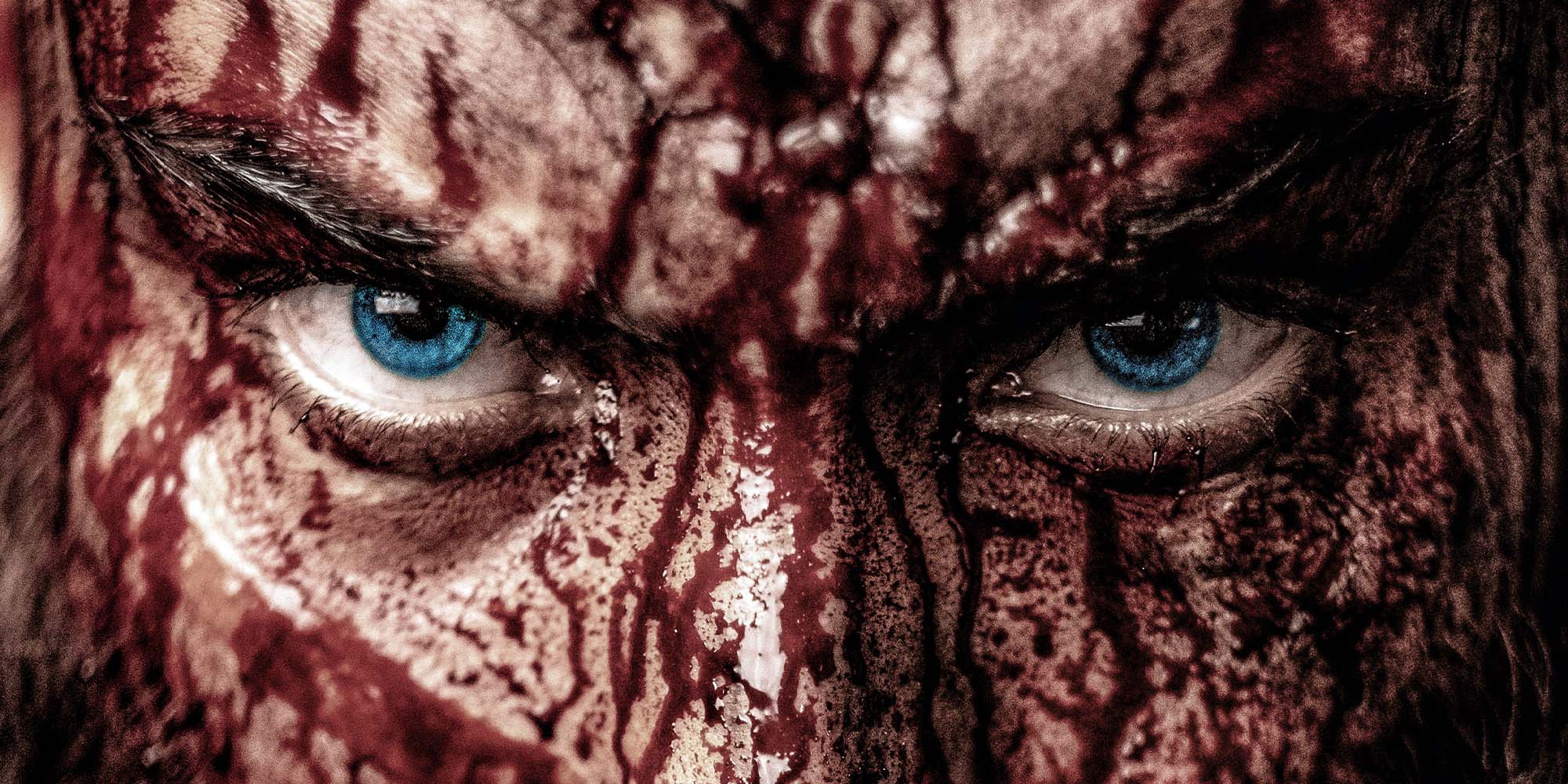 Blodig viking med blåa ögon