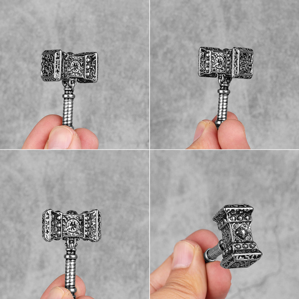 Amulett formad som hammaren Mjölner ur fornnordiska berättelser