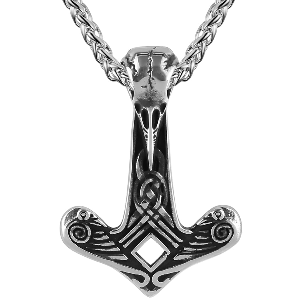 Viking amulett smyckad med korpar
