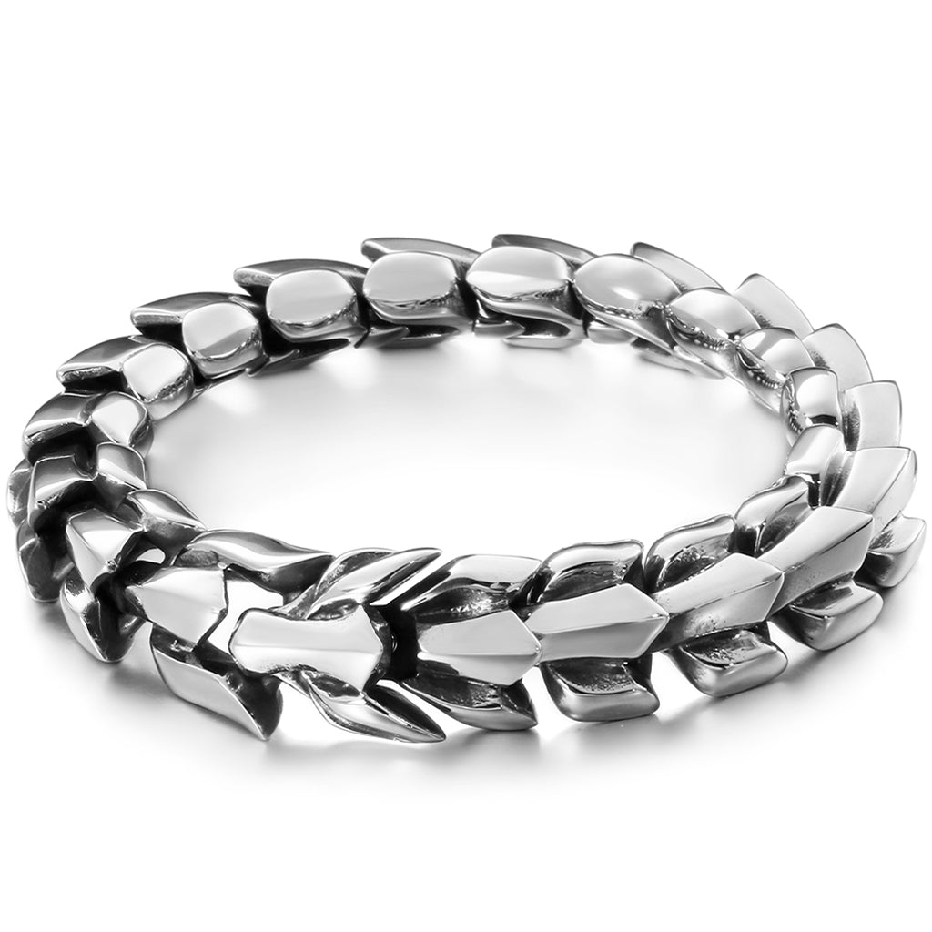 Viking armband i stål avbildande en svansbitande drake