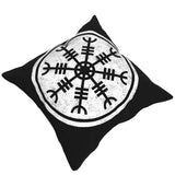 Mörk prydnadskudde med vitt motiv av magisk runsymbol från Island