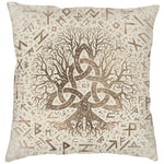 Vit kudde med textiltryck av guldfärgat vikingamotiv föreställande träd och runor