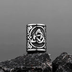 Skäggpärla i rostfritt stål med motiv av triquetra-symbol